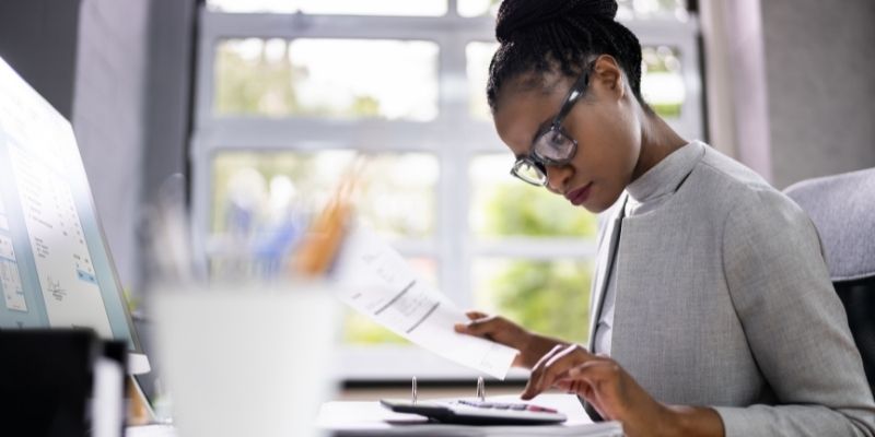 female accountant bookkeeping at a desk